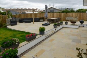 Patio area to the rear of Ridgegrove with seating, pergola and parasol