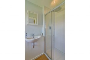 En suite bathroom with walk in, overhead shower in bedroom 1 at Ridgegrove