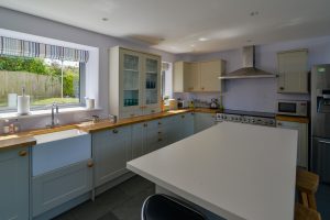 Well equipped kitchen at Ridgegrove with large island and Belfast sink