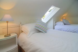Top floor twin room with ensuite toilet and wash basin at Sailaway