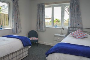 Twin bedroom on the lower garden level floor at Sailaway