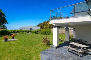 View of rear garden at first floor balcony from the garden level patio at Sailaway