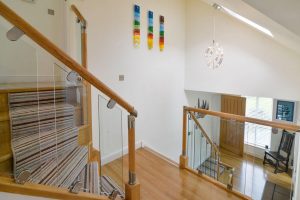 Picture of ground floor entrance hallway and stairs from the first floor hallway