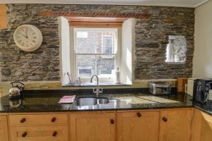Kitchen sink area with window to the rear yard at Santa Marina