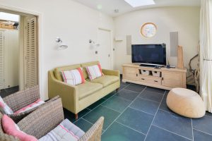 Small lounge off the dining area at Santa Marina with seating and TV