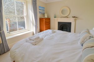 First floor king bedroom at the rear of Santa Marina with feature fireplace