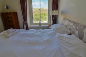 First floor king bedroom as the front of Santa Marina with kings bed and view to front of the house