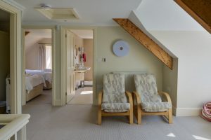 Picture of play area at Santa Marina showing doors into one of the twin bedrooms and bathroom on the 2nd floor