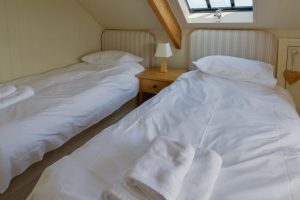 Twin beds in one of the bedrooms on the second floor at Santa Marina