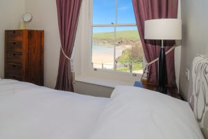 First floor king bedroom to the front of Santa Marina with view over the beach and ocean