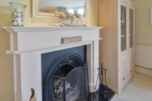 Fire place with fire surround and mantel piece at Santa Marina