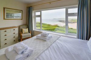 Ensuite superking bedroom at South Corner with large window with view overlooking Treyarnon Bay