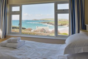 Ensuite superking bedroom with views over the beach and ocean at South Corner with the option to make the room into a twin room on request
