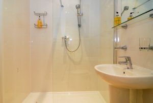 Ensuite shower room to the second superking bedroom at South Corner with shower cubicle, toilet and wash basin