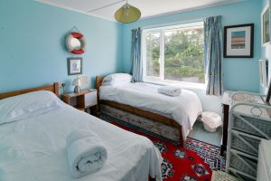 Twin room at Thalassa with large window to garden