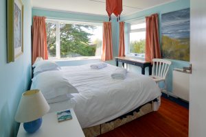 Superking bedrooms at Thalassa with large windows to garden