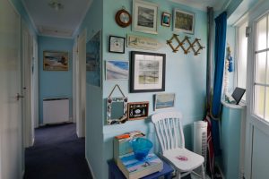 Entrance way at Thalassa with wall pictures
