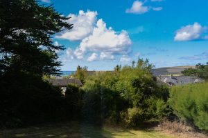 View of the lower part of the garden at Thalassa and towards Trevose Head