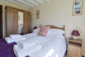 Ground floor double bedroom at The Buck with wardrobe and bedside tables
