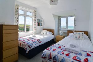 One of the two twin rooms on the first floor at The Buck with views to the front and side of the house