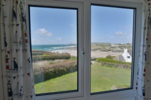 View over the beach and ocean from one of the twin rooms at The Buck