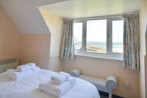 First floor king bedroom at the buck with view over the beach and ocean