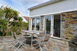 The rear patio and dining furniture at The Ridings