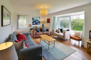 Lounge at The Ridings with sliding doors to the font patio seating and tv