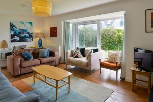Lounge at The Ridings with sliding doors to the font patio seating and tv