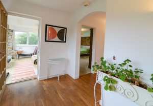 Hallway at The Ridings with doors to the entrance room and the master king bedroom