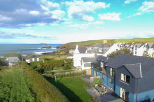 Aerial view over the rear garden towards the ocean at Torridon and some of the adjacent properties