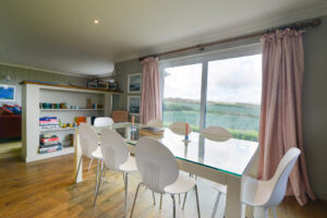The dining area on the first floor at Torridon with views over the countryside to the rear of the house