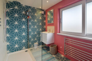 The ensuite to the second superking bedroom at Torridon with shower and wash basin