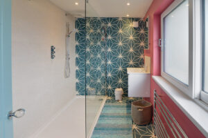 The ensuite to the second superking bedroom at Torridon with shower and wash basin
