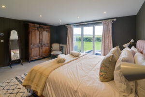 Ground floor master ensuite superking bedroom with doors the bedrooms patio