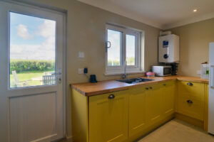 Utility room at Torridon with door to the rear patio