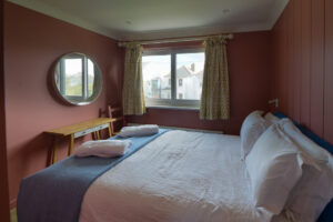 First floor ensuite king bedroom at Torridon with window to the front of the house