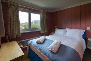 First floor ensuite king bedroom at Torridon with window to the front of the house