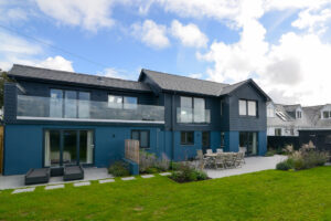 Rear exterior from the grassed lawn at Torridon showing patios and balconies