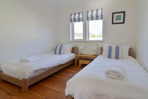 The twin bedroom at Tregarne with window to the front of the property