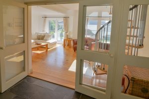 Double doors from the entrance hall into the lounge at Tregarne