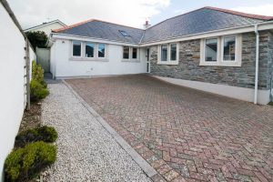 The front exterior and parking at Tregarne