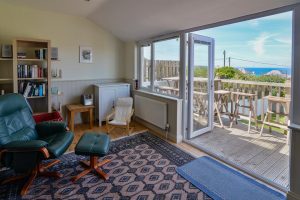 Double doors and ample windows in the garden room at Wispa