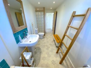 Ground floor bathroom at Sunset showing shower cubicle, toilet and wash basin
