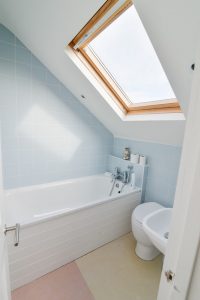 First floor bathroom at Sunset with velux window bath toilet and wash basin
