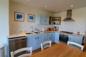 Kitchen counter area at Sunset with integrate oven and hob and dishwasher
