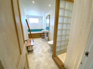Ground floor bathroom at Sunset with bath, shower cubicle, wash basin and toilet