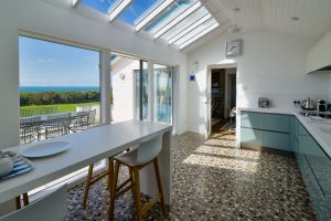 Well equipped kitchen with bar stools and sea views at Atlantic Breezes