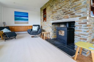 Log burner in lounge at Atlantic Breezes