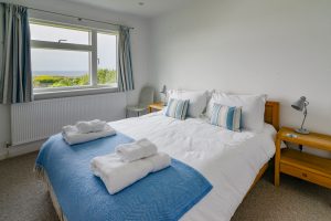 Ground floor King sized bedroom with sea views at Atlantic Breezes